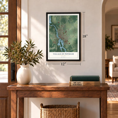 Village of Potsdam, New York map, 12 x 18 inch print in a black frame in an entryway