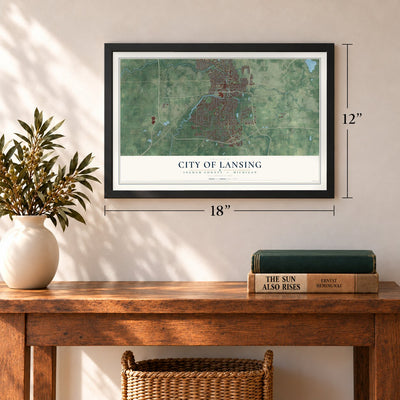 Lansing, Michigan map, 12 x 18 inch print in a black frame in an entryway