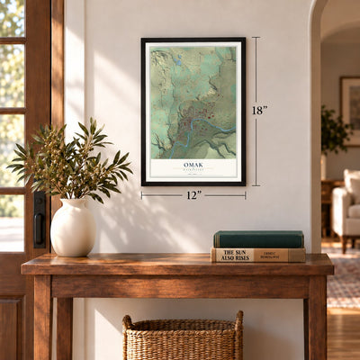 Omak, Washington map, 12 x 18 inch print in a black frame in an entryway