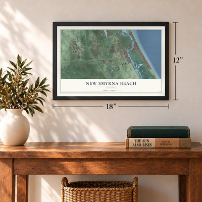 New Smyrna Beach, Florida map, 12 x 18 inch print in a black frame in an entryway