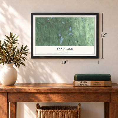 Sand Lake, New York map, 12 x 18 inch print in a black frame in an entryway