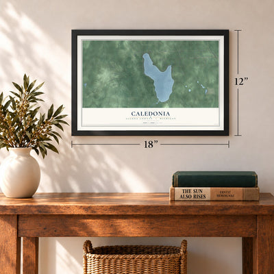 Caledonia, Alcona County, Michigan map, 12 x 18 inch print in a black frame in an entryway