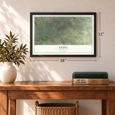 Aztec, New Mexico map, 12 x 18 inch print in a black frame in an entryway