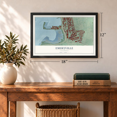 Emeryville, California map, 12 x 18 inch print in a black frame in an entryway