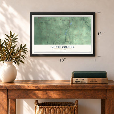 North Collins, New York map, 12 x 18 inch print in a black frame in an entryway