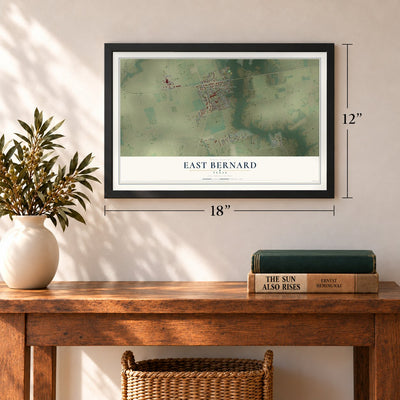 East Bernard, Texas map, 12 x 18 inch print in a black frame in an entryway