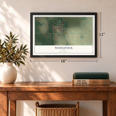 Woolstock, Iowa map, 12 x 18 inch print in a black frame in an entryway