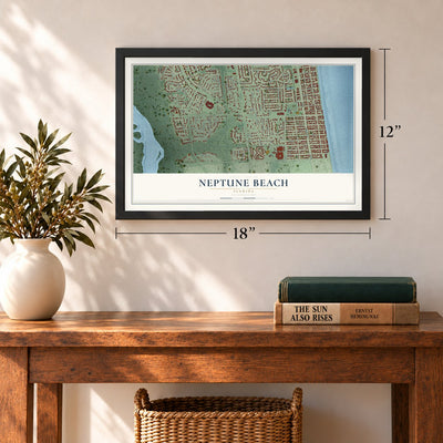 Neptune Beach, Florida map, 12 x 18 inch print in a black frame in an entryway