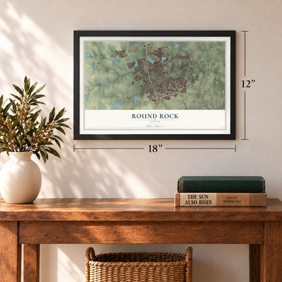 Round Rock, Texas map, 12 x 18 inch print in a black frame in an entryway