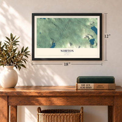 Norton, Vermont map, 12 x 18 inch print in a black frame in an entryway