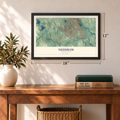 Needham, Massachusetts map, 12 x 18 inch print in a black frame in an entryway