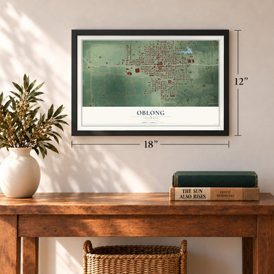 Oblong, Illinois map, 12 x 18 inch print in a black frame in an entryway
