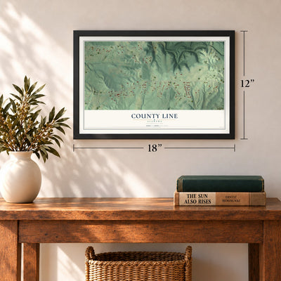 County Line, Alabama map, 12 x 18 inch print in a black frame in an entryway