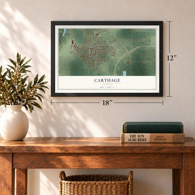 Carthage, Illinois map, 12 x 18 inch print in a black frame in an entryway