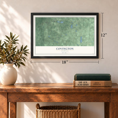 Covington, Michigan map, 12 x 18 inch print in a black frame in an entryway