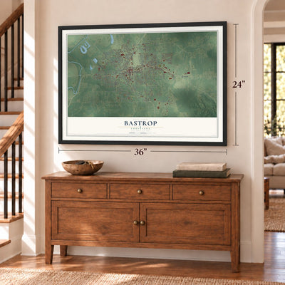 Bastrop, Louisiana map, 24 x 36 inch print in a black frame above a dresser by a staircase