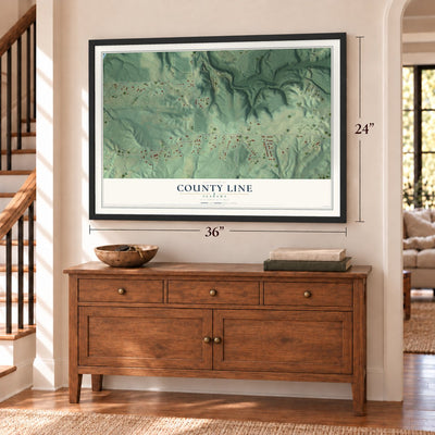 County Line, Alabama map, 24 x 36 inch print in a black frame above a dresser by a staircase