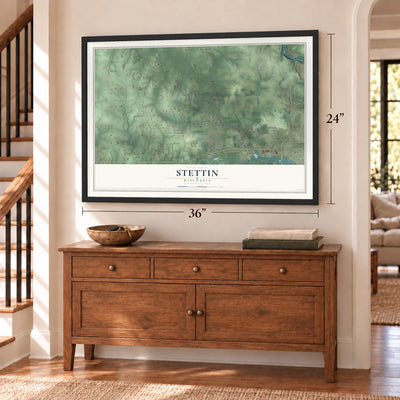 Stettin, Wisconsin map, 24 x 36 inch print in a black frame above a dresser by a staircase