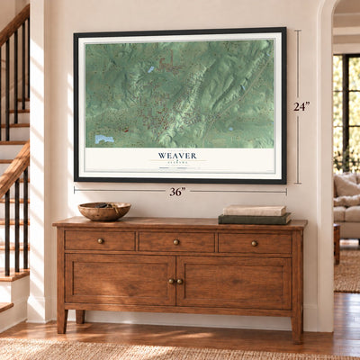 Weaver, Alabama map, 24 x 36 inch print in a black frame above a dresser by a staircase