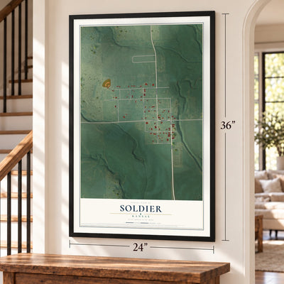 Soldier, Kansas map, 24 x 36 inch print in a black frame by a staircase