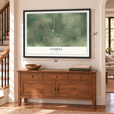 Combes, Texas map, 24 x 36 inch print in a black frame above a dresser by a staircase