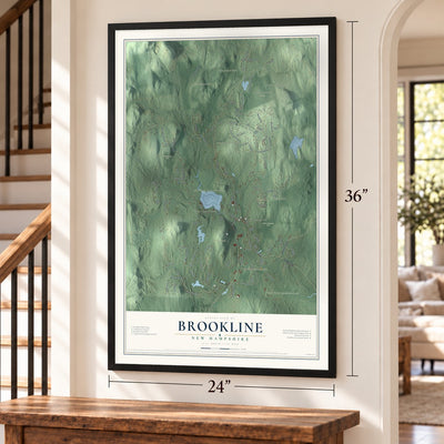 Brookline, New Hampshire map, 24 x 36 inch print in a black frame by a staircase