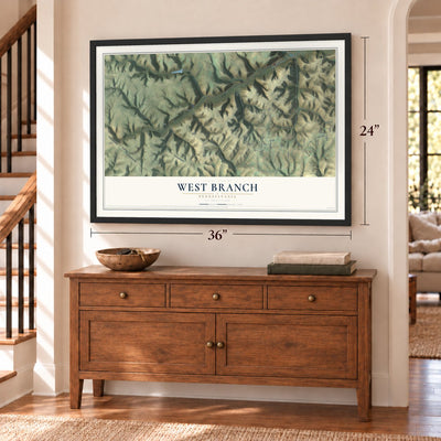West Branch, Pennsylvania map, 24 x 36 inch print in a black frame above a dresser by a staircase