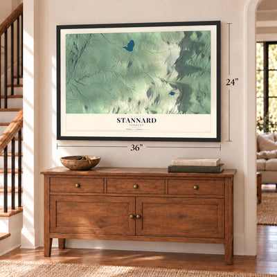 Stannard, Vermont map, 24 x 36 inch print in a black frame above a dresser by a staircase