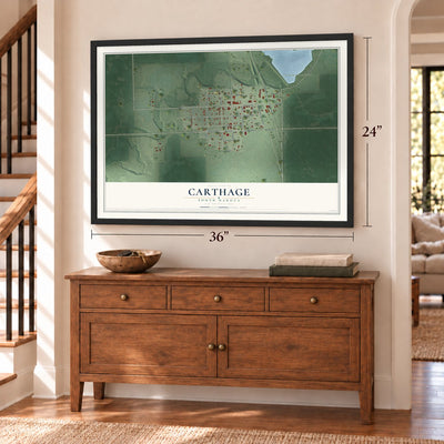 Carthage, South Dakota map, 24 x 36 inch print in a black frame above a dresser by a staircase