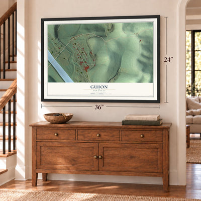 Guion, Arkansas map, 24 x 36 inch print in a black frame above a dresser by a staircase