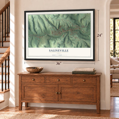 Salineville, Ohio map, 24 x 36 inch print in a black frame above a dresser by a staircase