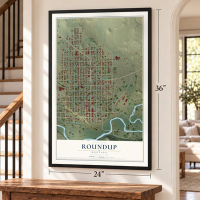 Roundup, Montana map, 24 x 36 inch print in a black frame by a staircase