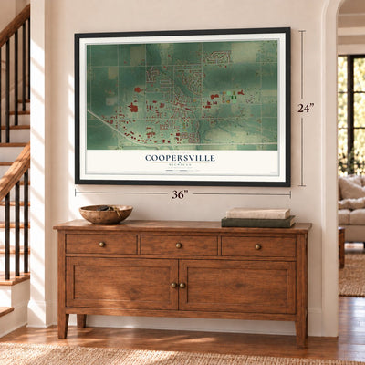 Coopersville, Michigan map, 24 x 36 inch print in a black frame above a dresser by a staircase