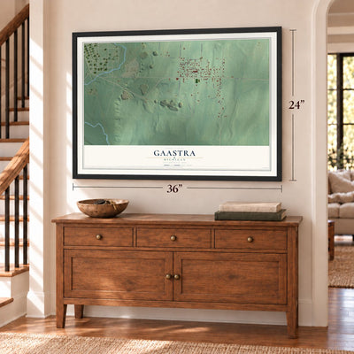 Gaastra, Michigan map, 24 x 36 inch print in a black frame above a dresser by a staircase