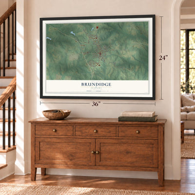 Brundidge, Alabama map, 24 x 36 inch print in a black frame above a dresser by a staircase