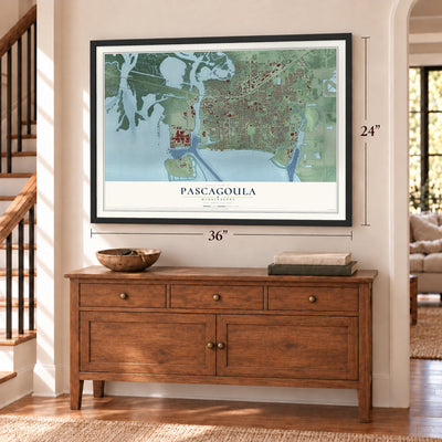 Pascagoula, Mississippi map, 24 x 36 inch print in a black frame above a dresser by a staircase