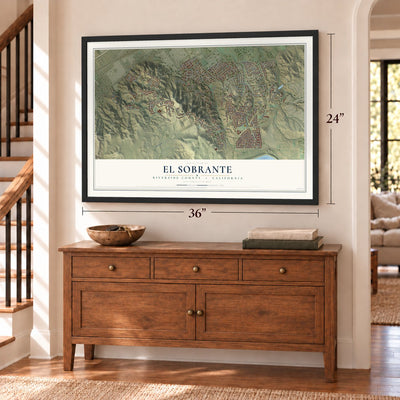El Sobrante, Riverside County, California map, 24 x 36 inch print in a black frame above a dresser by a staircase