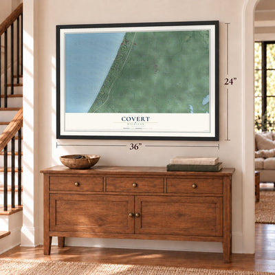 Covert, Michigan map, 24 x 36 inch print in a black frame above a dresser by a staircase