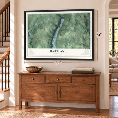 Hartland, Connecticut map, 24 x 36 inch print in a black frame above a dresser by a staircase