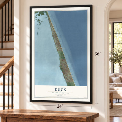 Duck, North Carolina map, 24 x 36 inch print in a black frame by a staircase