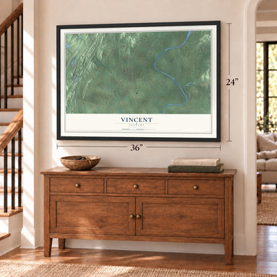 Vincent, Alabama map, 24 x 36 inch print in a black frame above a dresser by a staircase