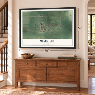 Meadville, Missouri map, 24 x 36 inch print in a black frame above a dresser by a staircase