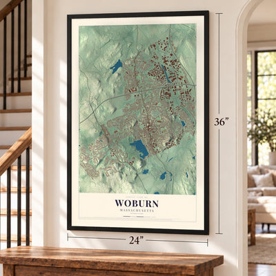 Woburn, Massachusetts map, 24 x 36 inch print in a black frame by a staircase