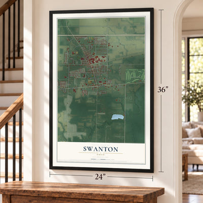 Swanton, Ohio map, 24 x 36 inch print in a black frame by a staircase