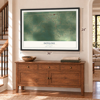 Doyline, Louisiana map, 24 x 36 inch print in a black frame above a dresser by a staircase