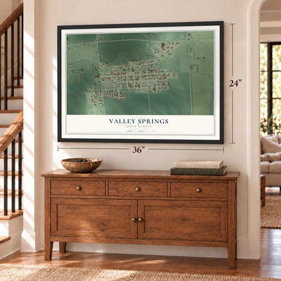 Valley Springs, South Dakota map, 24 x 36 inch print in a black frame above a dresser by a staircase
