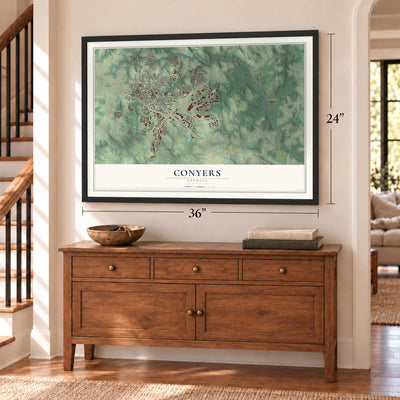 Conyers, Georgia map, 24 x 36 inch print in a black frame above a dresser by a staircase