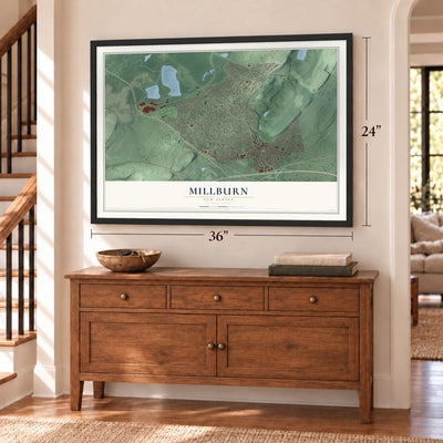 Millburn, New Jersey map, 24 x 36 inch print in a black frame above a dresser by a staircase