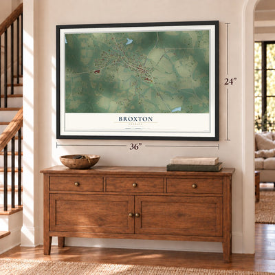Broxton, Georgia map, 24 x 36 inch print in a black frame above a dresser by a staircase