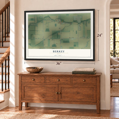 Berkey, Ohio map, 24 x 36 inch print in a black frame above a dresser by a staircase